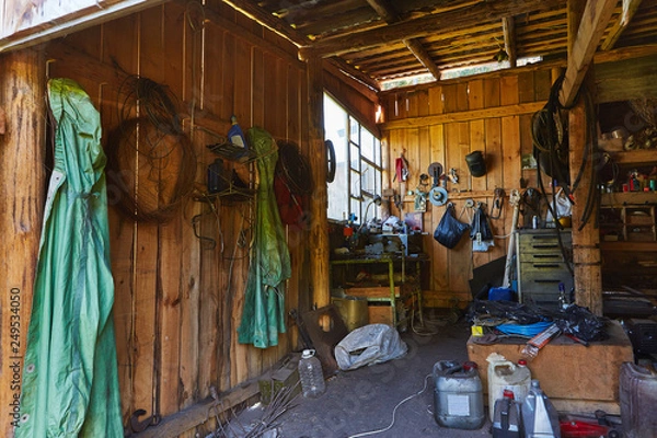 Fototapeta Workshop shed garage with toold for repare and atv inside
