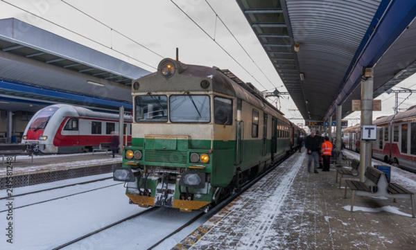 Fototapeta Presov station in winter snow morning with trains and platforms