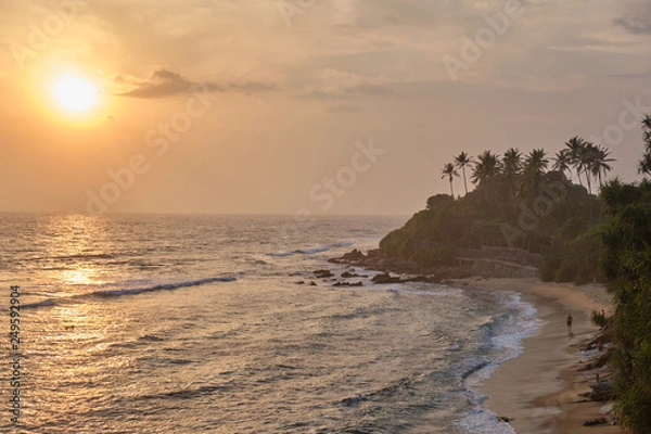 Fototapeta Beautiful view of the beach at sunset.