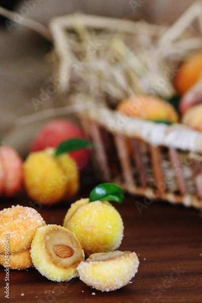 Fototapeta Peach shaped cookies with nut and caramelized milk inside