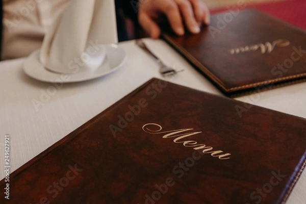 Obraz Man in restaurant reading the menu