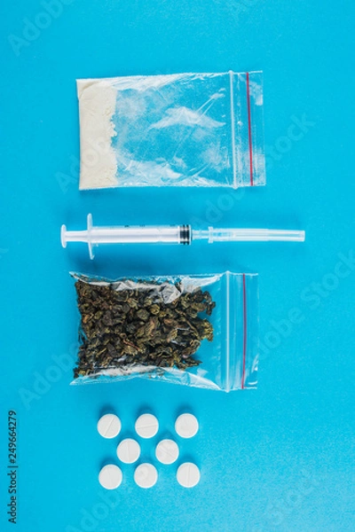Fototapeta Illegal drugs. Heroin, ecstasy, cocaine and marijuana. Space for text