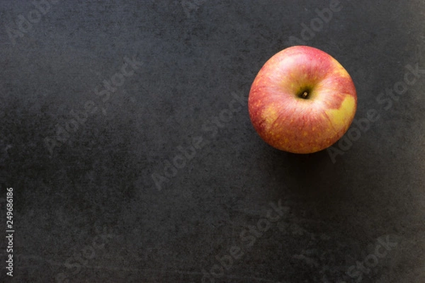 Obraz apple on black background,