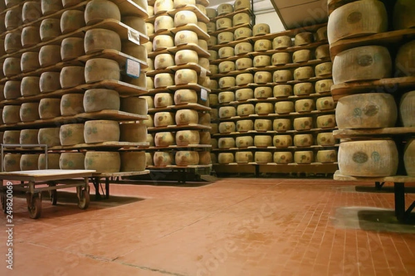 Obraz Abstract, blur, bokeh background, defocusing - image for the background. shelves of a cheese maturing warehouse
