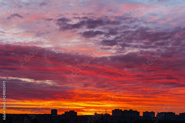 Fototapeta Sunset sky over night cityscape