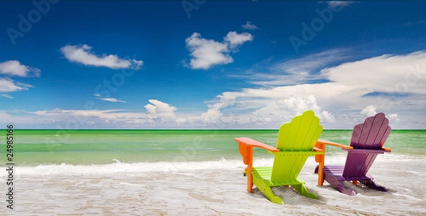Fototapeta Colorful chairs at a trpoical beach in Miami Florida