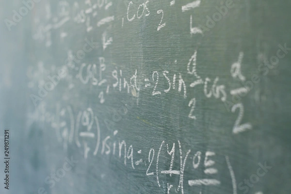 Fototapeta Math formula on blackboard background in classroom. Education and activity in classroom concept.
