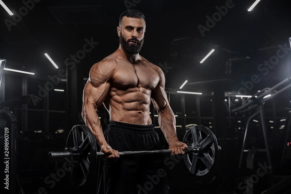 Fototapeta Muscular man working out in gym doing exercises, strong male naked torso abs - Изображение