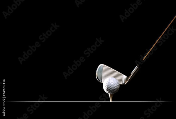 Fototapeta Golf ball on the tee on plain black background 