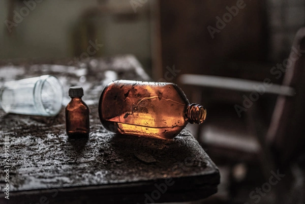 Obraz an old bottle of glycerin is on the old table