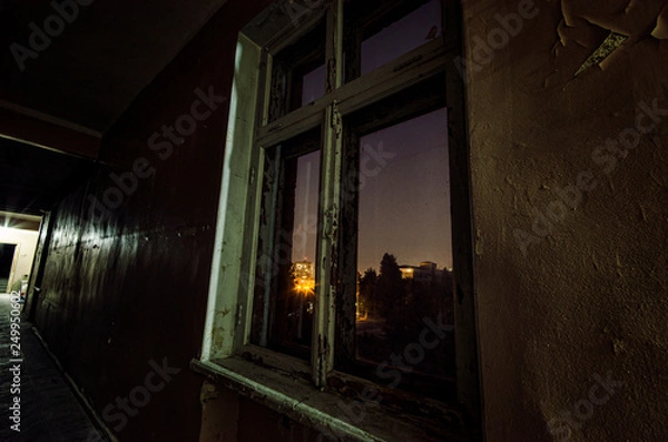 Obraz Dark corridor. Mystical interior of dark empty corridor, tunnel in an abandoned house. Dark mysterious corridor. The interior of an abandoned house, road to hell.