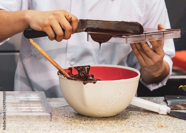 Fototapeta Chocolate fudge frosting, making chocolate fudge