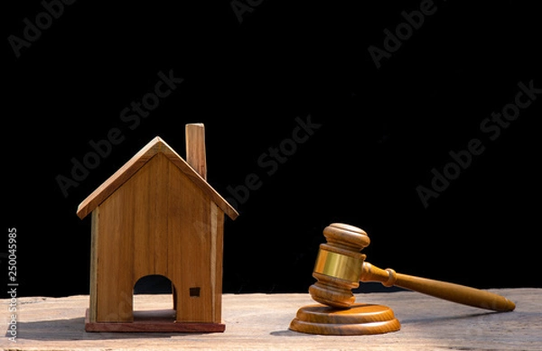 Fototapeta  model house, judge's gavel on wooden background. purchase, sale of real estate