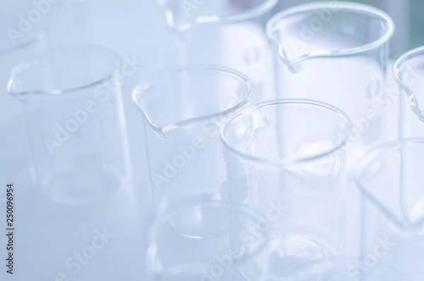 Fototapeta A pipette dropping sample into a test tube,abstract science background