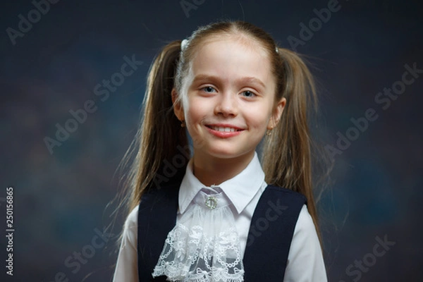 Fototapeta Smiling Caucasian Elementary Schoolgirl Portrait
