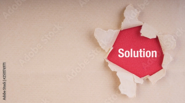 Obraz SOLUTION text on brown envelope and torn paper. Concept Image
