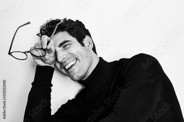 Obraz Smiling guy with glasses in studio