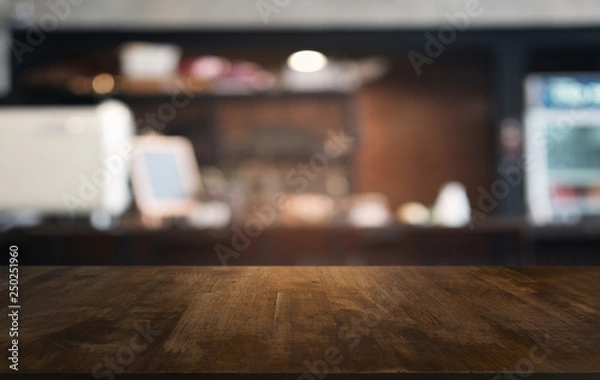 Fototapeta Empty dark wooden table in front of abstract blurred bokeh background of restaurant . can be used for display or montage your products.Mock up for space.