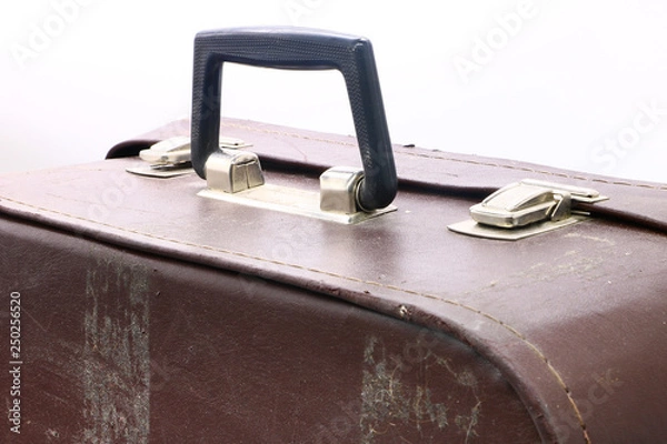 Obraz old and battered suitcase on white background