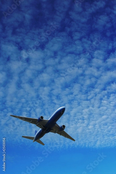 Obraz airplane over blue sky