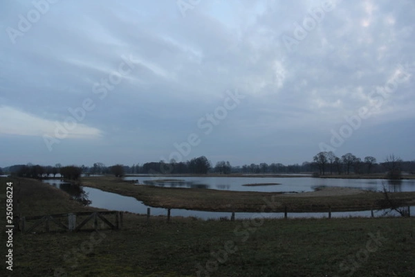 Obraz View over lake cloudy sky