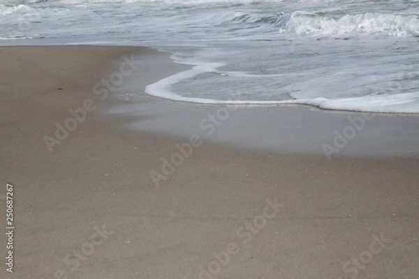 Fototapeta sea waves float to the sandy beach