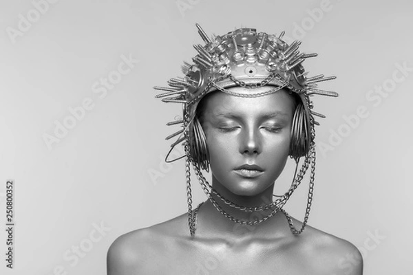 Obraz Futuristic woman in metal helmet with screws, nuts and chains