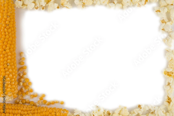 Fototapeta making popcorn at home: corn on the cob well dried are white, some grains are separated and the finished product is near. Frame,  isolated on white