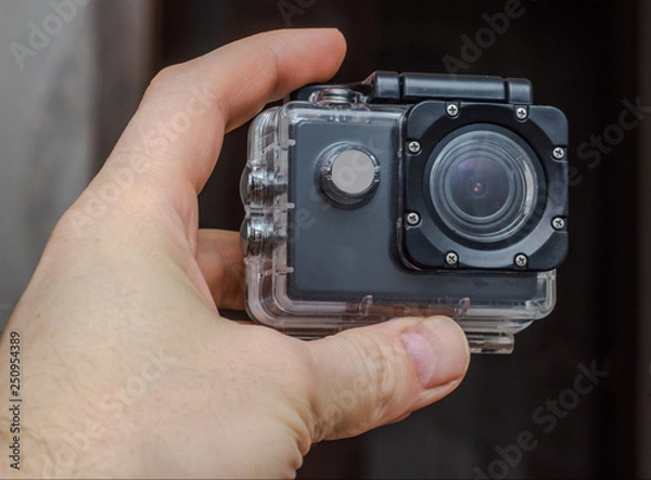 Fototapeta Underwater Box Action Camera in the hand of man