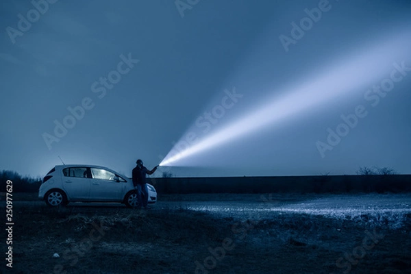 Obraz Man exploring outdoor at night