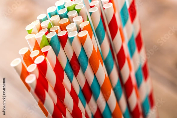 Obraz Eco friendly stripped paper straws in a glass, closeup