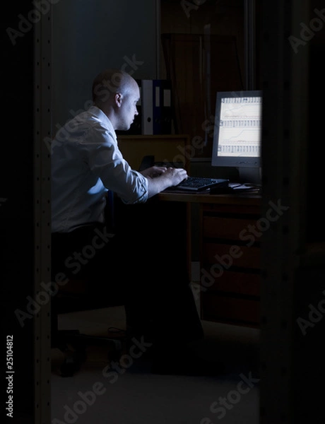 Obraz Late night office worker working overtime.