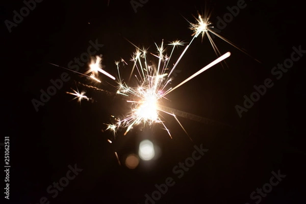 Obraz sparkler on black background