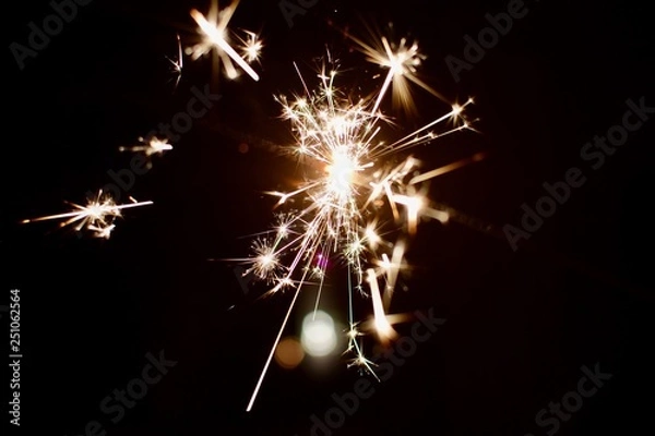 Obraz sparkler on black background