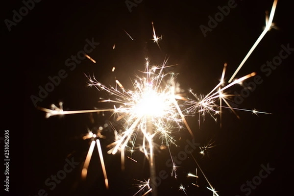 Obraz sparkler on black background