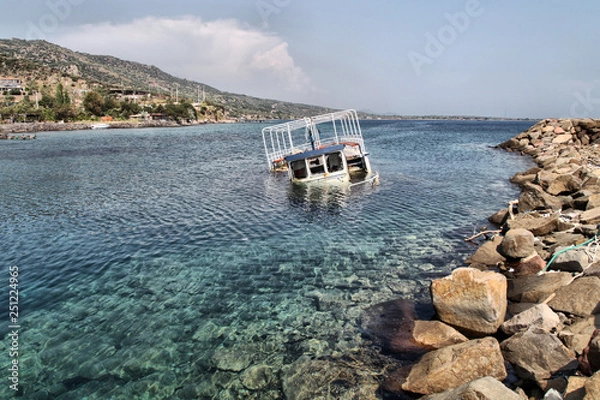 Obraz A half submerged fisherman boat is in Sokakagzi bay, Aegean Sea