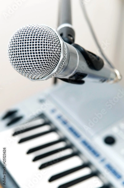 Fototapeta microphone and piano keyboard close-up