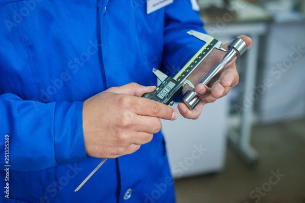 Obraz Quality Specialist Hands with measuring devices