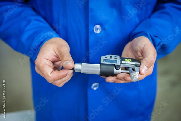 Obraz Quality Specialist Hands with measuring devices