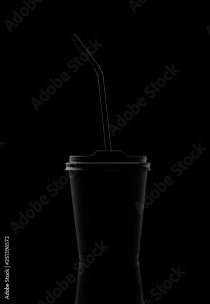 Obraz Black paper cup with a lid and a straw. On a black background.