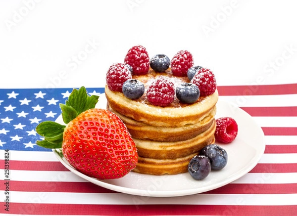 Fototapeta Heap of pancakes with berries on USA flag