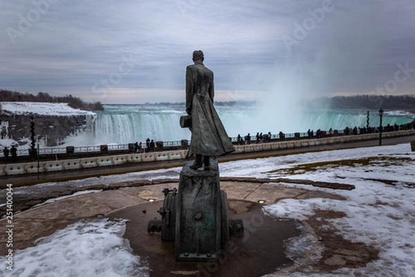 Fototapeta Niagara Falls CANADA - February 23, 2019: Nikola Tesla Sculpture in Queen Victoria Park in Niagara Falls, Canada. The monument was designed by sculptor Les Drysdale and opened in 2006.