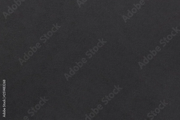 Fototapeta Black soft foam material matte surface with tiny grainy rough texture pattern abstract background design for presentation, banner, brochure wallpaper