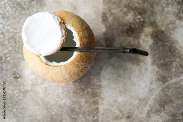 Fototapeta Close Up of Coconut water with blurred background and copyspace.