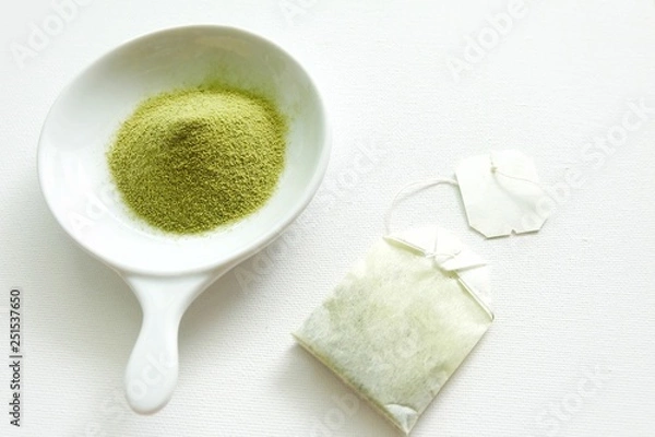 Obraz Green tea on white plate and white background. 