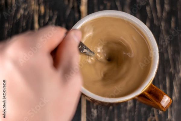 Obraz Top view of white cup of coffee isolated on brown background