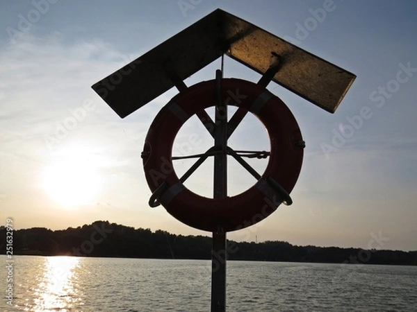 Obraz Orange Rescue Circle Life Buoy Save Wharf Harbor Marina Yard