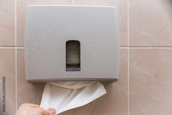 Obraz plastic box with tissues paper in the toilet