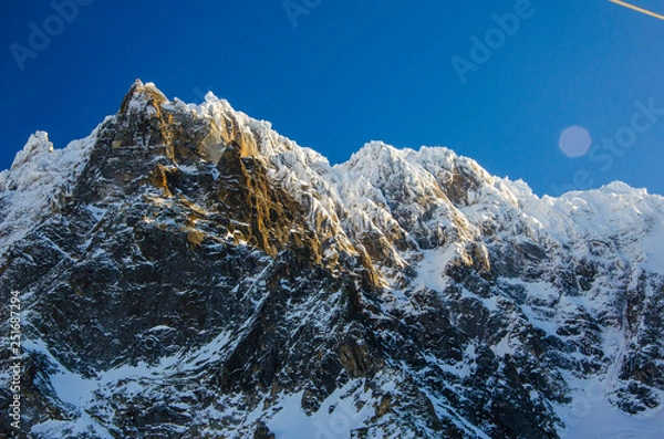 Fototapeta Mountains landscape in french Chamonix Mont Blanc during winter. Amazing view. and perfect place for skiing and snowboarding.
