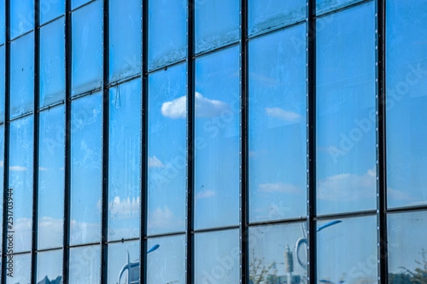 Fototapeta Sky and cloud reflection in windows of modern skyscrapers